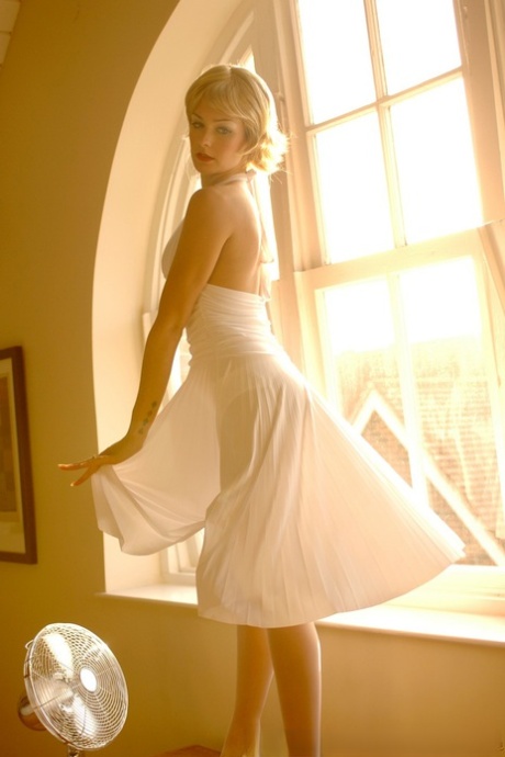 British MILF in a white dress Natasha Marley flashes her panties and stockings